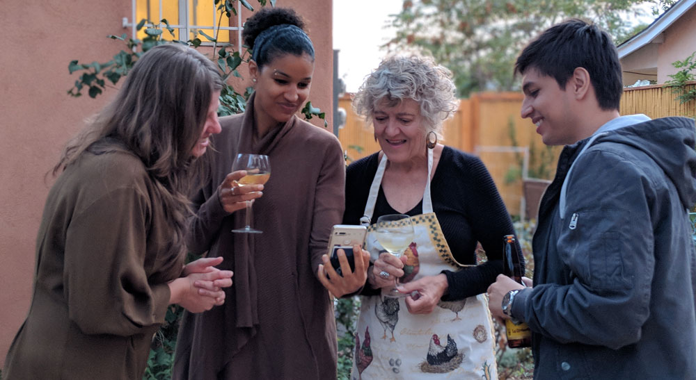 Decorative photo of people socializing in a garden